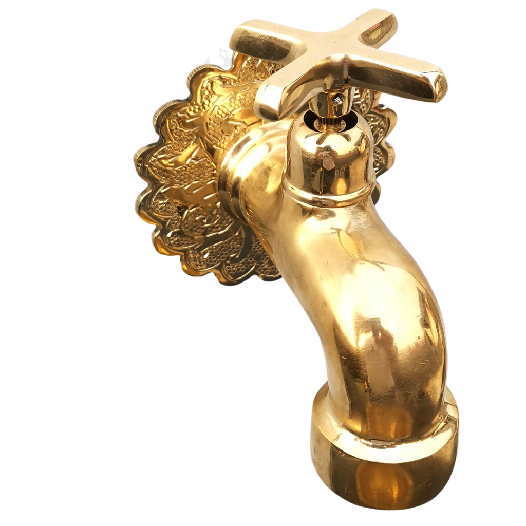 Side view of antique brass bathroom faucet with cross handle